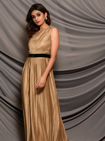 One shoulder gold pleated gown with attached black velvet belt