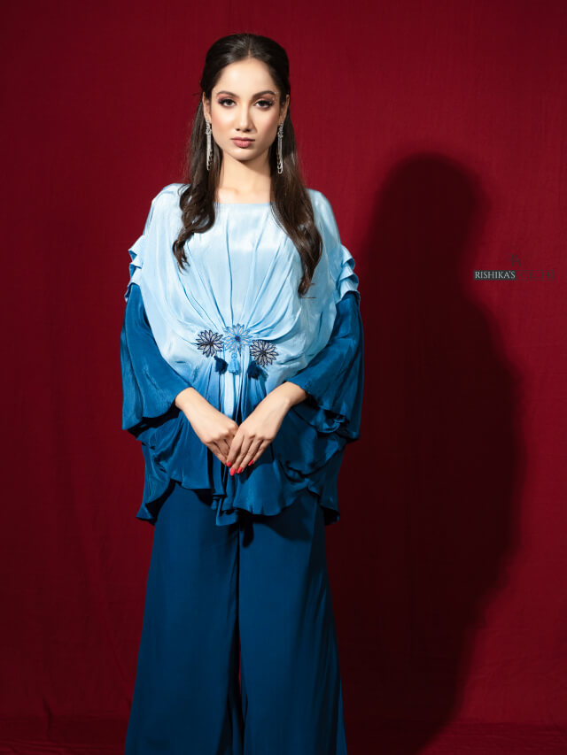 Blue ombre draped top with embellishment on the middle